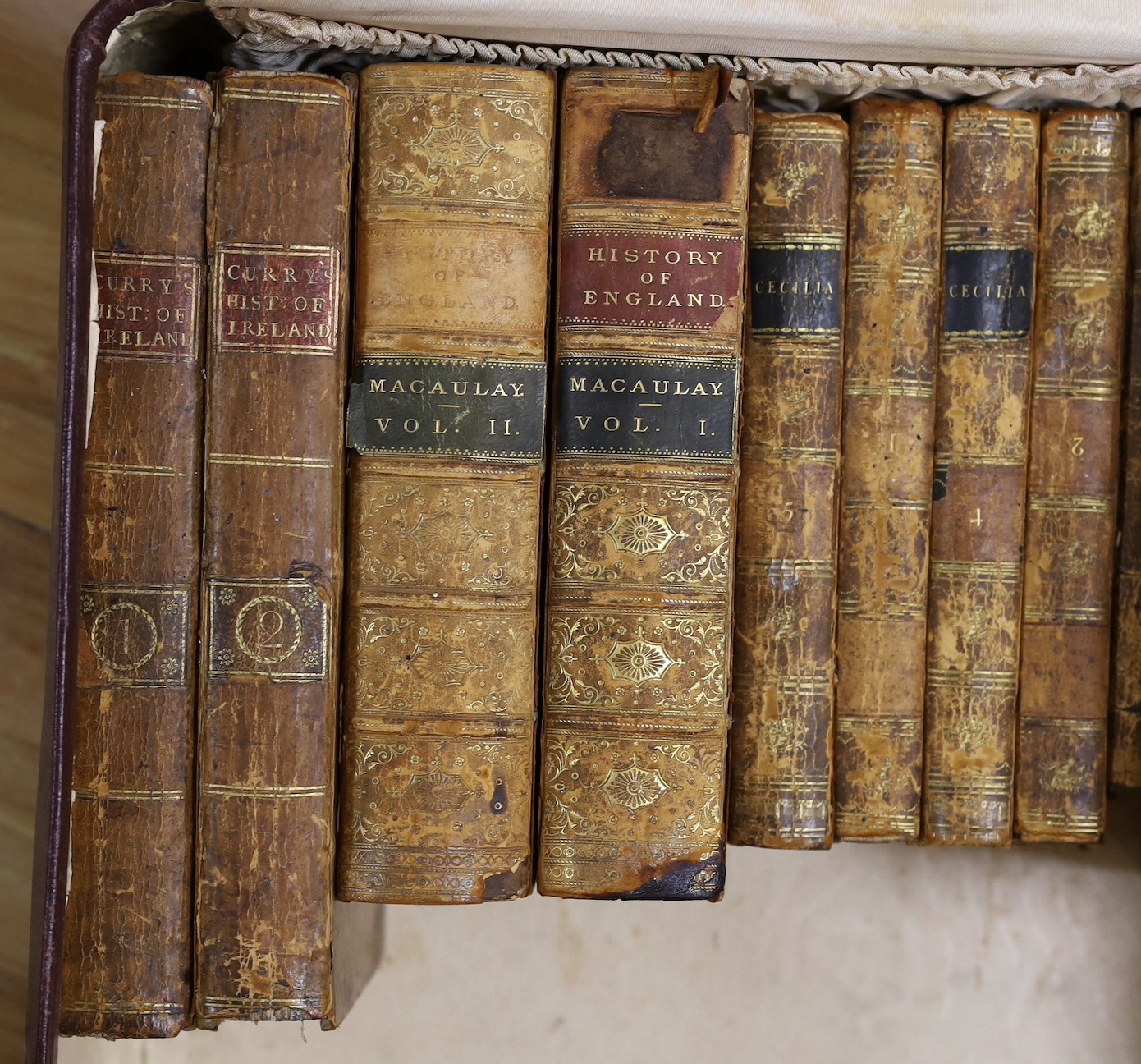 A quantity of leather bound books and a J R R Tolkein volume of The Hobbit with original dust jacket